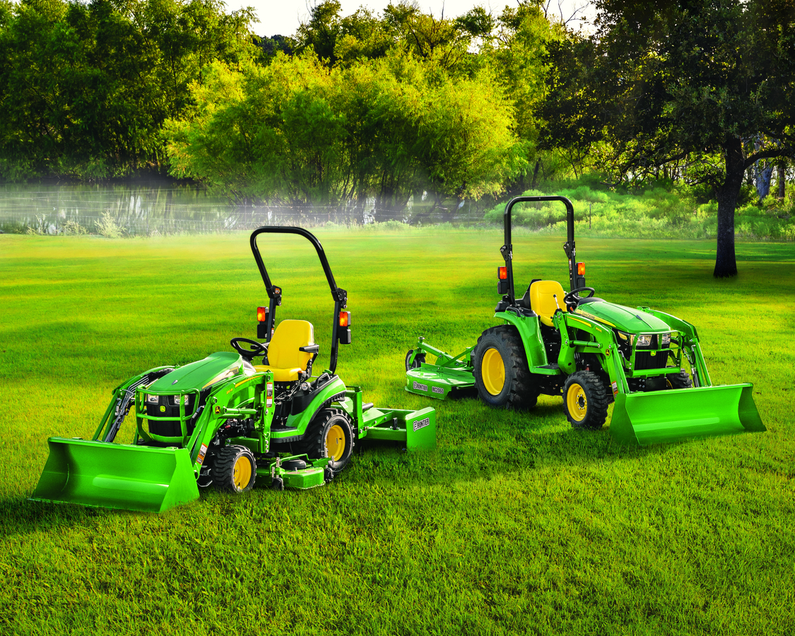 John Deere 3025 E Compact Tractors on the green lawn